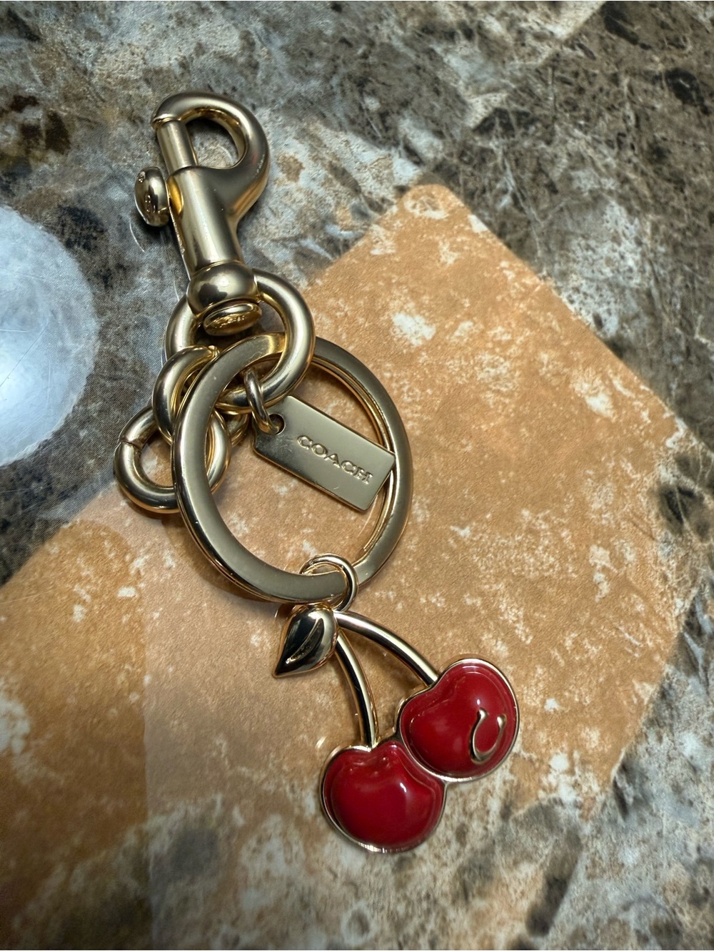 Coach Gold-Tone Keychain with Red Cherry Enamel Charm